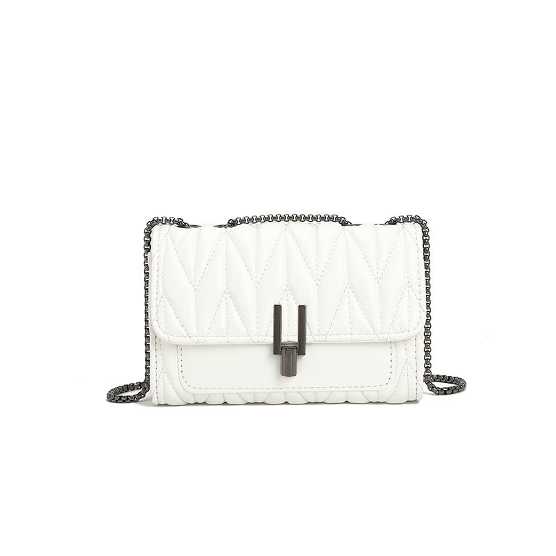 Elegant white quilted leather handbag with chain strap for stylish fashion enthusiasts