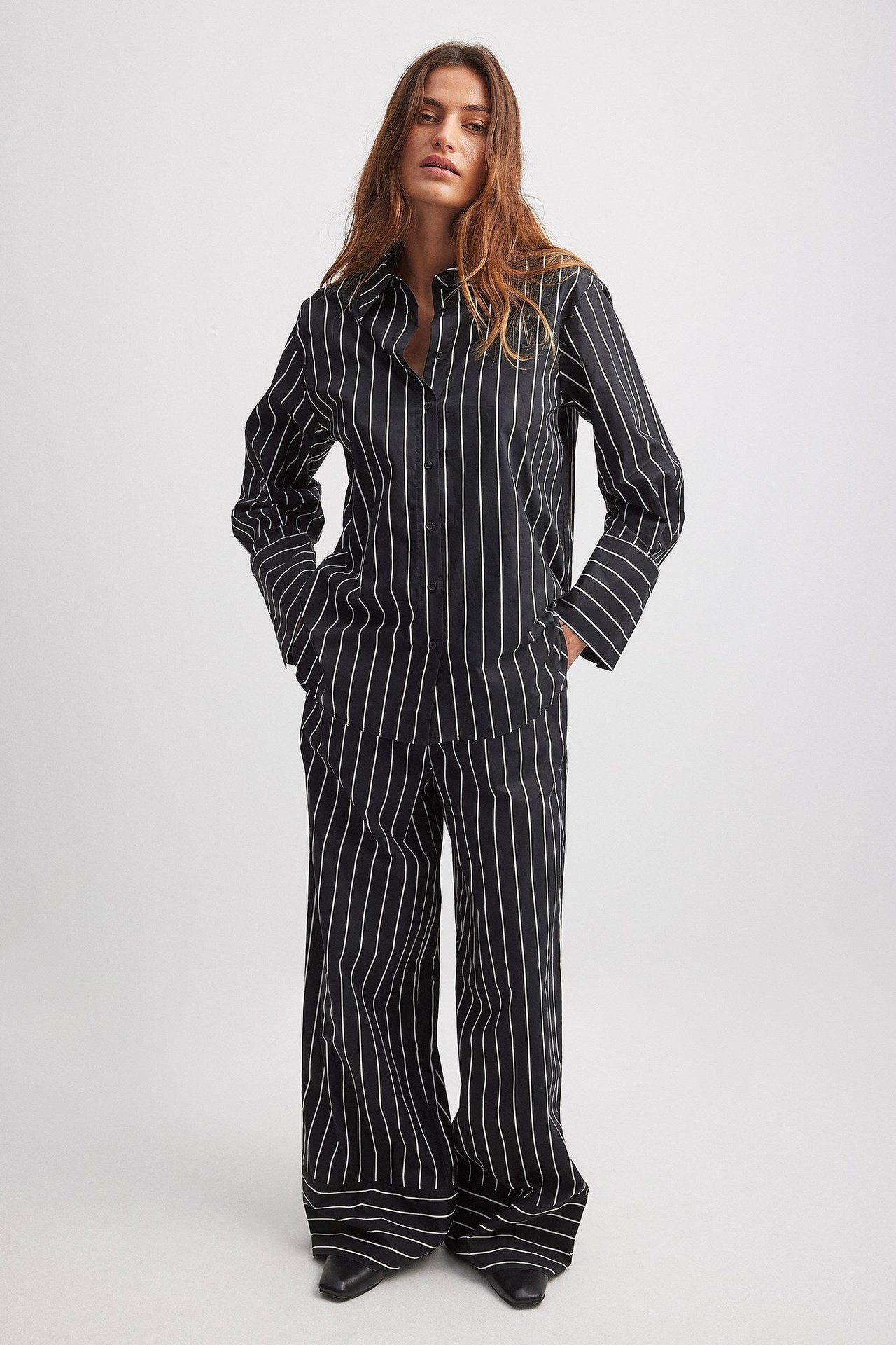 Black and white pinstriped jumpsuit with wide-leg pants in Office Elegant Wide Leg Pants Set