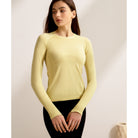 Pale yellow fitted sweater with crew neckline, ideal for langry running fitness fashion