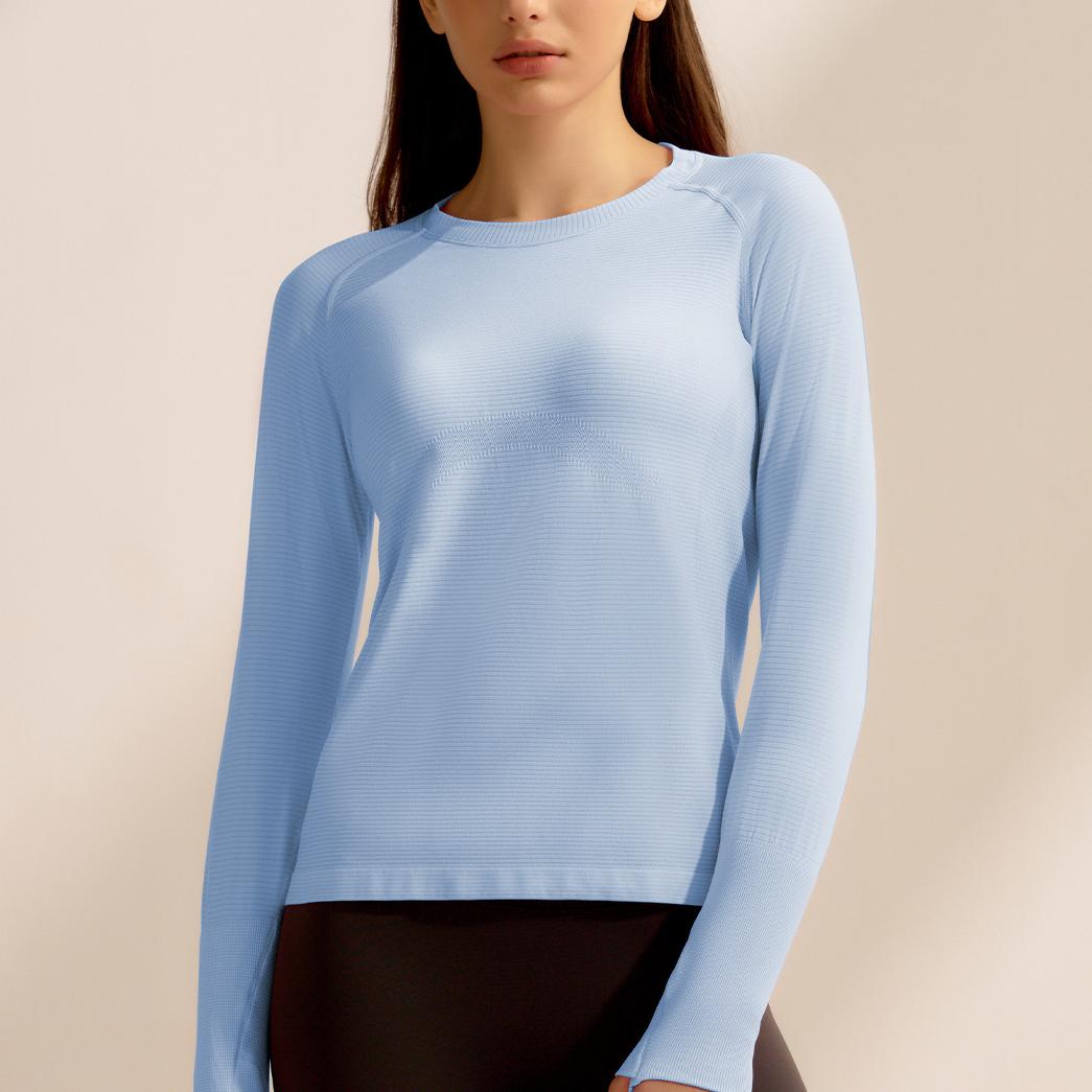 Light blue long-sleeved knit sweater, a stylish choice in ملابس for fitness enthusiasts