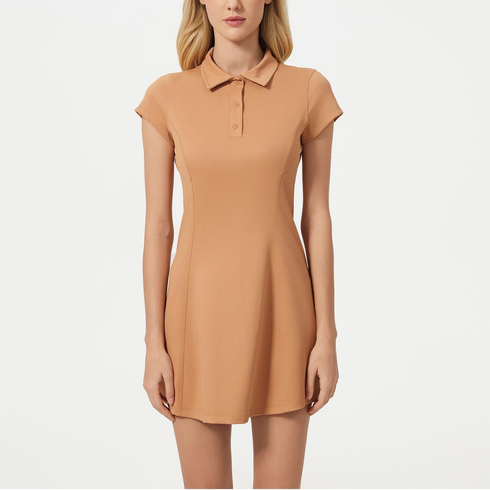 Peach-colored polo dress with short sleeves, perfect for trendy tennis fashion ملابس