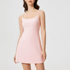 Light pink spaghetti strap mini dress with fitted silhouette for comfy fitness fashion