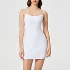 White sleeveless bodycon mini dress with thin straps, perfect for comfy fitness fashion