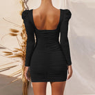 Black ruched bodycon dress with long sleeves and square neckline, ideal for modern fashion styles