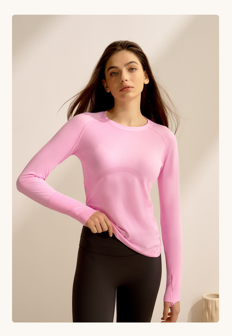 Pink long-sleeved crewneck sweater and black leggings, stylish langry fitness outfit