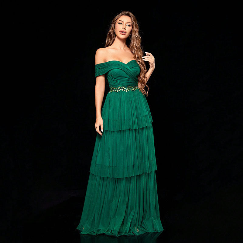 Elegant green off-the-shoulder gown from Gorgeous Design, a perfect fashion choice