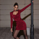 Burgundy long-sleeved dress with ruched detailing and cutout neckline for elegant fashion