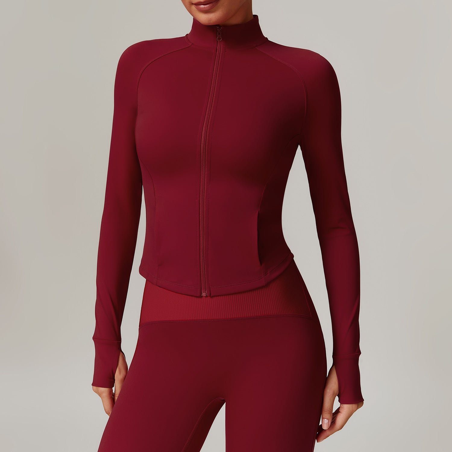 Burgundy long-sleeved athletic zip-up top for activewear fashion and ملابس comfort