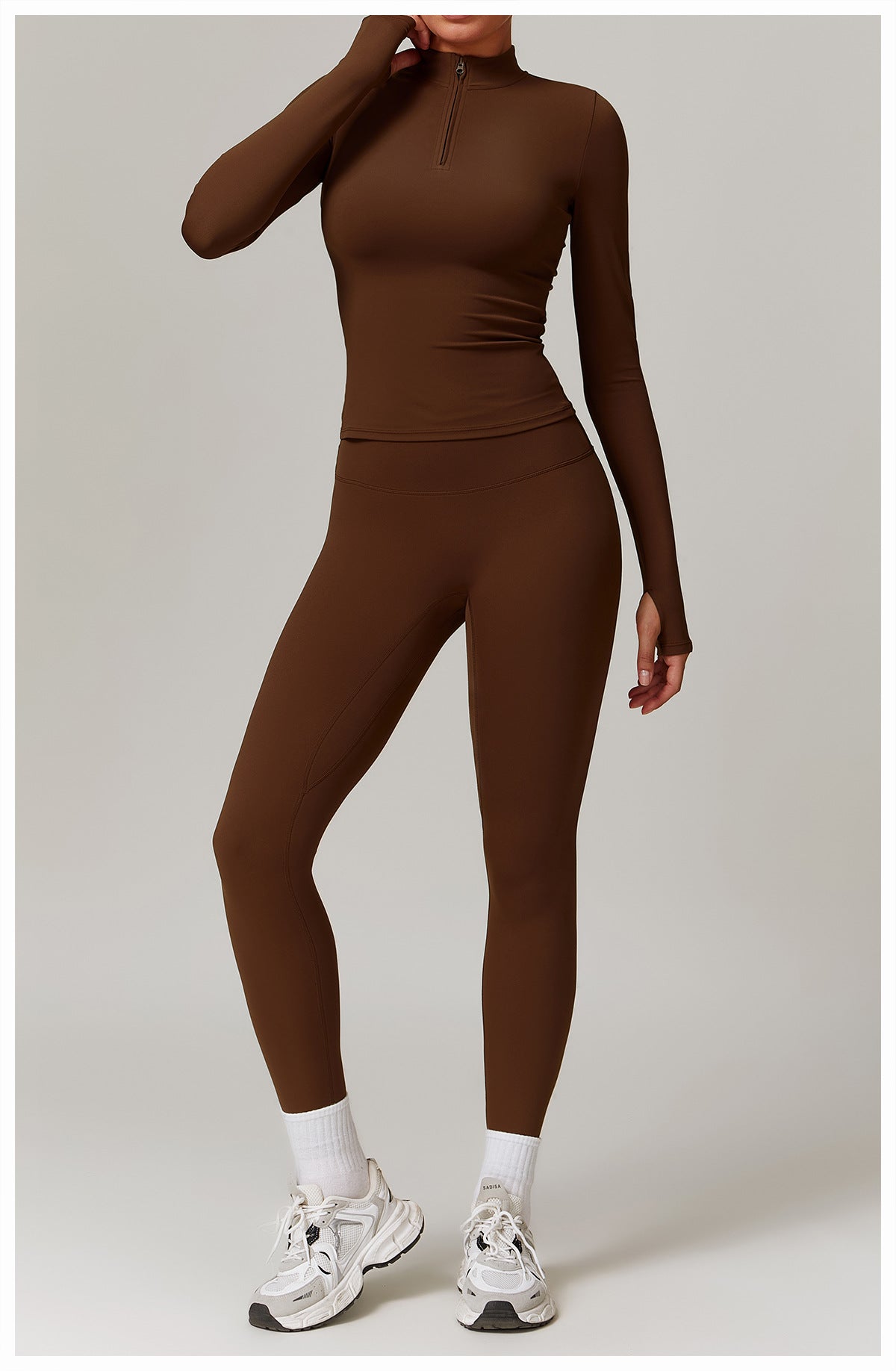 Brown long-sleeved athletic jumpsuit with white sneakers for langry outdoor fitness fashion