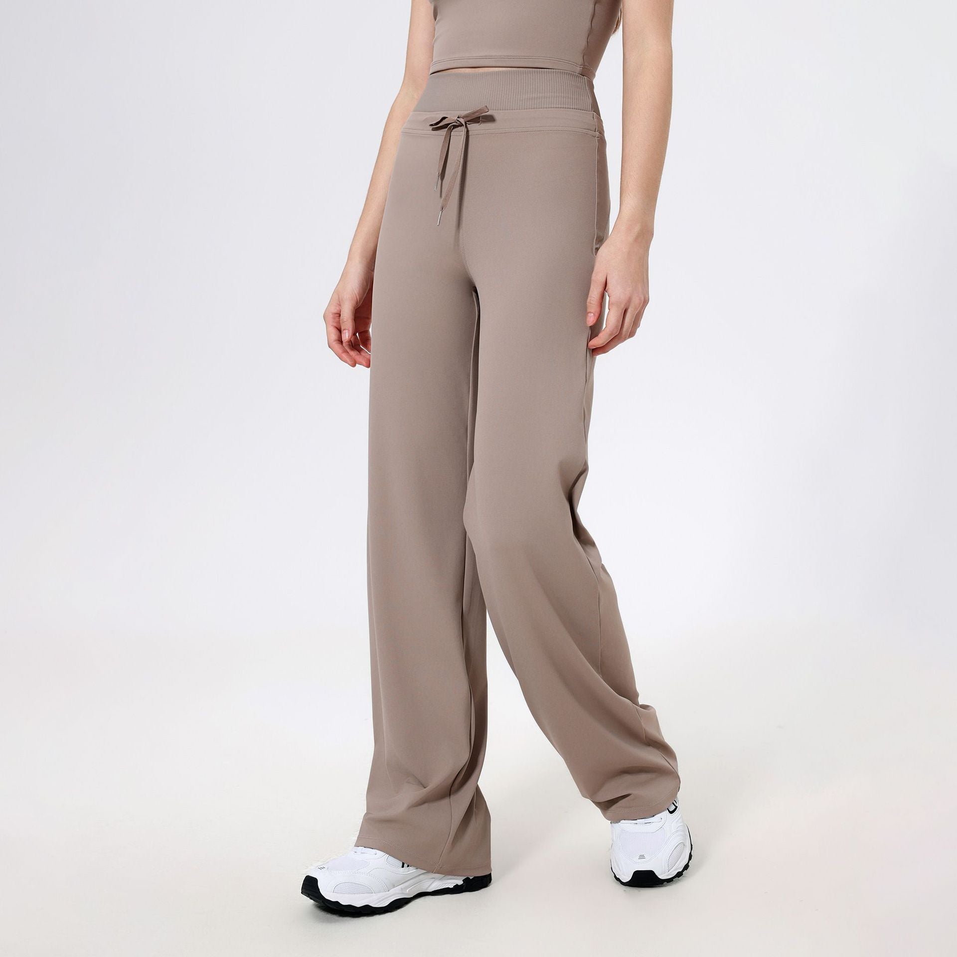 Taupe-colored wide-leg sweatpants with drawstring waist for stylish, casual fashion ملابس