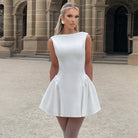 Sleeveless white mini dress with flared skirt, ideal for trendy fashion ملابس styles