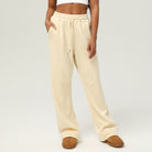 Cream-colored wide-leg sweatpants with drawstring waist, perfect for casual fitness and fashion