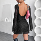 Black sparkly mini dress with long sleeves and open back, a stylish choice in fashion ملابس