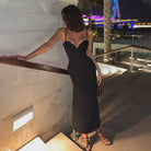 Elegant black evening dress with spaghetti straps, a fitted silhouette in light luxury fashion