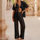 Black crochet beach cover-up set with short sleeve length shirt and wide-leg fashion trousers