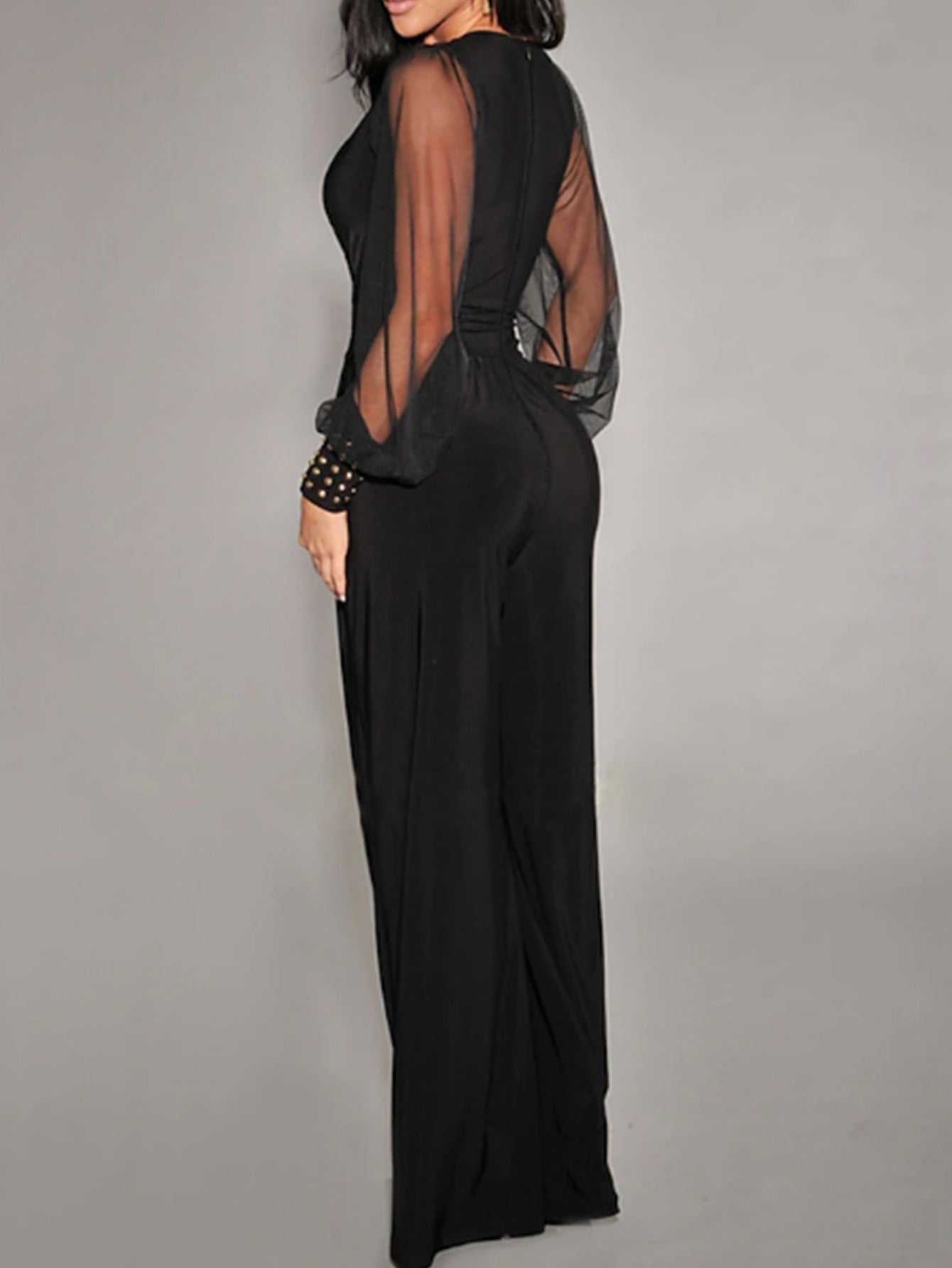 Elegant black jumpsuit with sheer mesh sleeves, perfect for trendy fashion ملابس