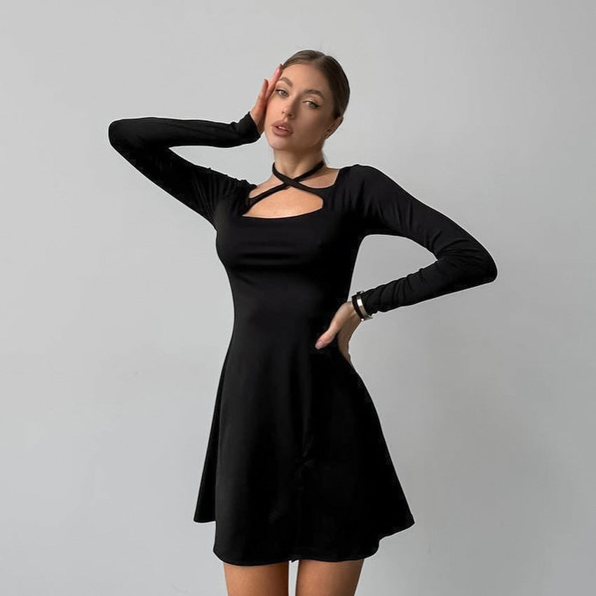 Elegant black long-sleeved langry dress with cutout neckline and flared skirt