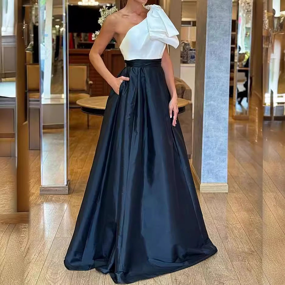 One-shoulder white and navy formal gown, perfect for elegant fashion occasions