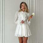 Elegant white ruffled dress from French Elegant Short Dress collection for stylish fashion