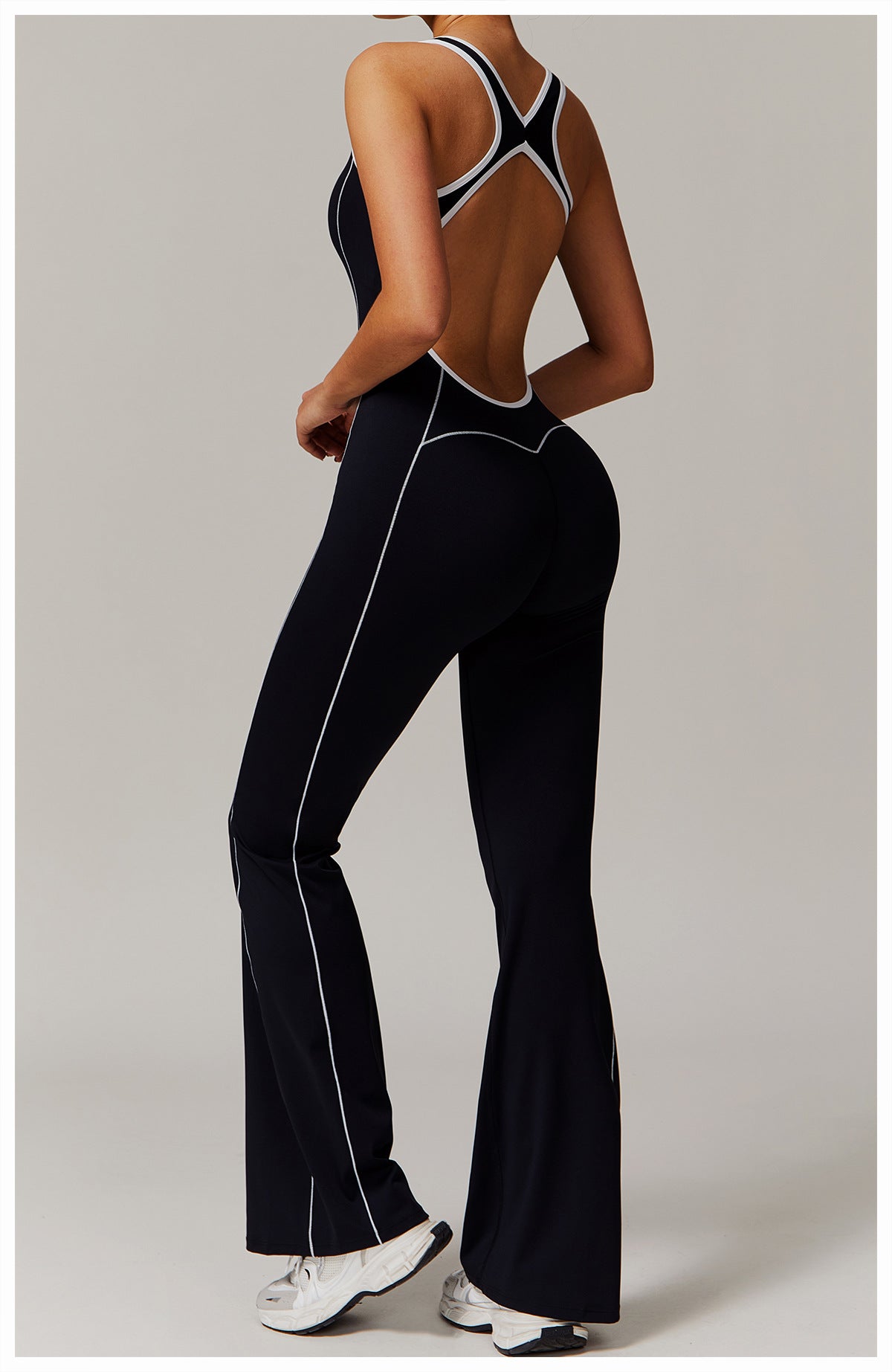 Black open-back jumpsuit with white trim, perfect for stylish langry fashion choices