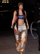 Person in Dior crop top and patterned wide-leg pants showcasing casual street style fashion