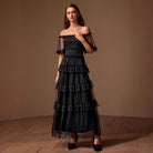 Black off-shoulder tiered lace evening gown, ideal for elegant fashion occasions