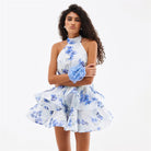 White halter dress with blue floral prints and ruffled skirt for elegant fashion looks