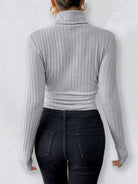 Gray ribbed turtleneck sweater and dark jeans styled for Langry fashion ملابس