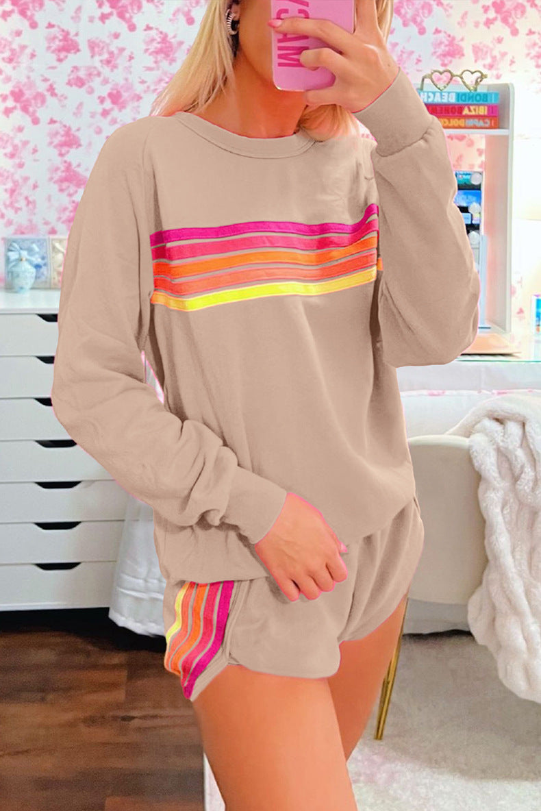 Beige loungewear set featuring rainbow stripes in pink, orange, and yellow for casual fashion