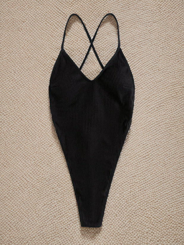 Black ribbed one-piece swimsuit with crossed back straps for stylish summer fashion