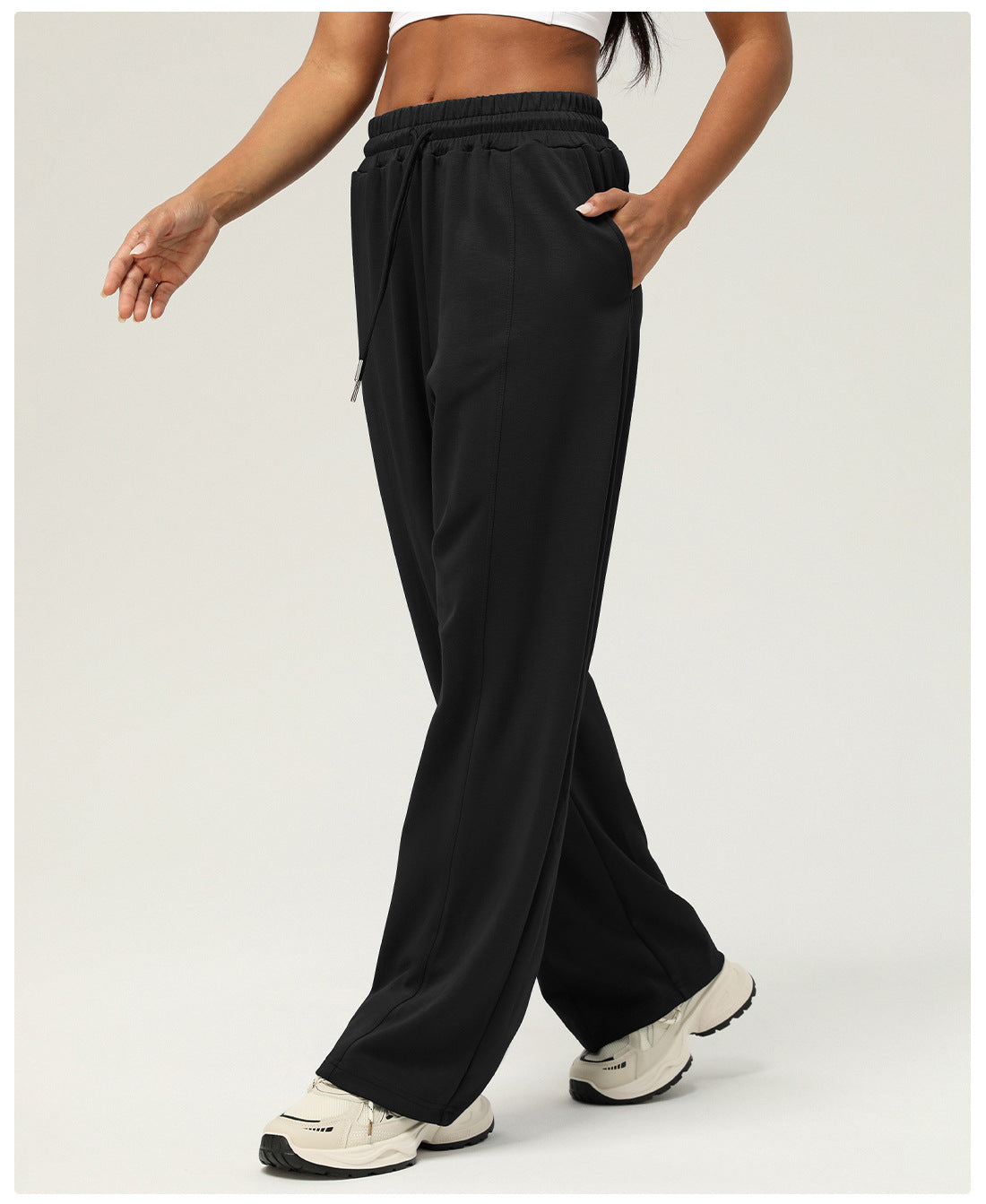 Black wide-leg sweatpants for casual fitness and yoga, featuring elastic waistband and pockets