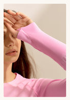 Pink knit sweater sleeve with ribbed cuff detail for stylish running fitness tops