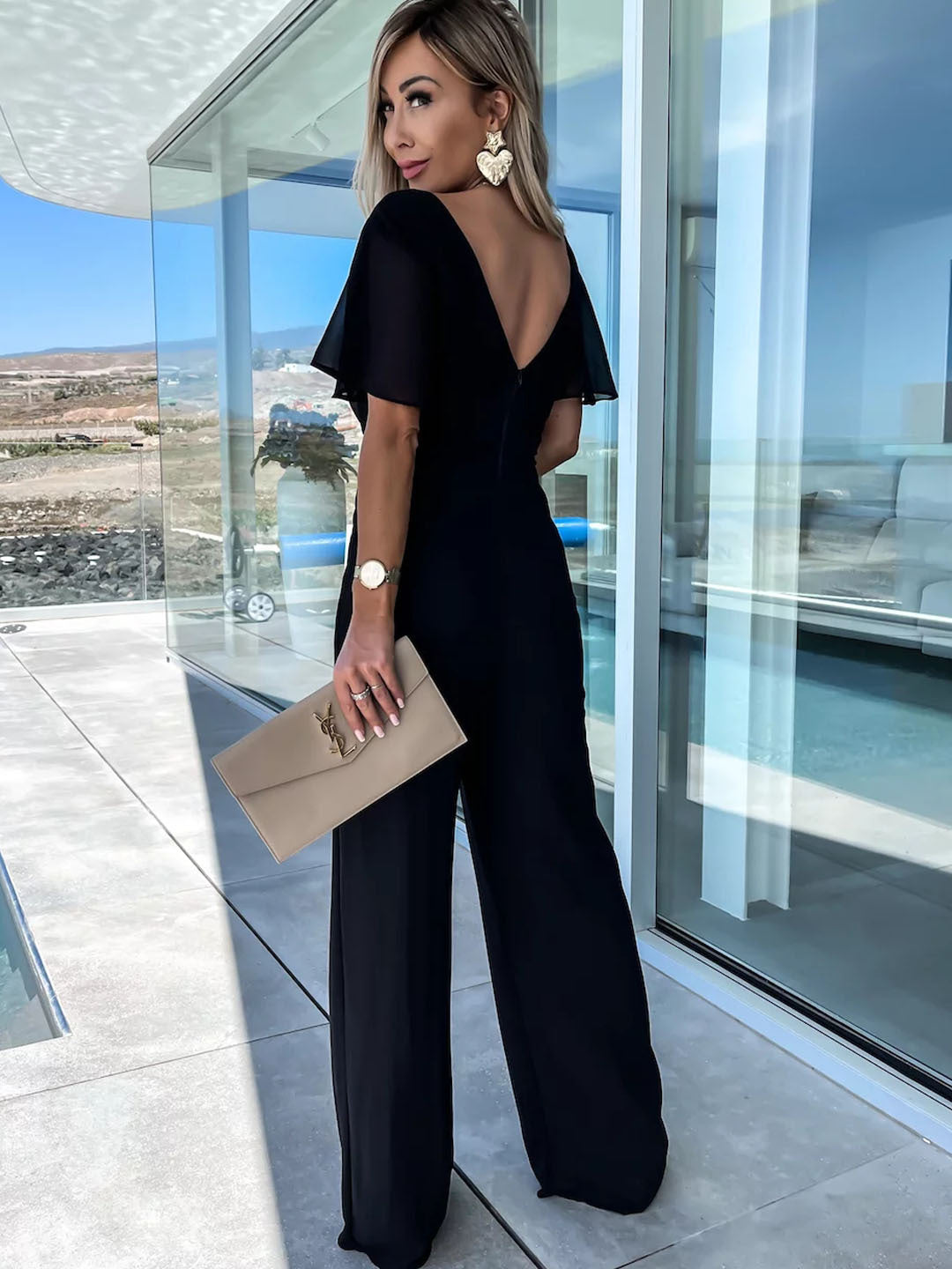 Black wide-leg jumpsuit from Langry, a stylish choice in ملابس for casual occasions