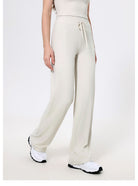 Cream-colored knit sweatpants with drawstring waist for stylish and comfortable fashion wear