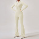 Cream-colored zip-front jumpsuit with flared legs and long sleeves for stylish comfort in ملابس