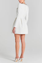 White long-sleeved mini dress with fitted waist and flared skirt for elegant fashion ملابس