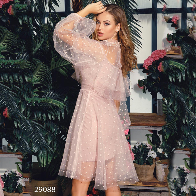 Elegant Evening Dress featuring a romantic pink tulle dress with pearl polka dots and puffy sleeves