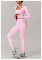 Pink athletic workout set featuring a soft jacket, leggings, and gray sneakers for fashion