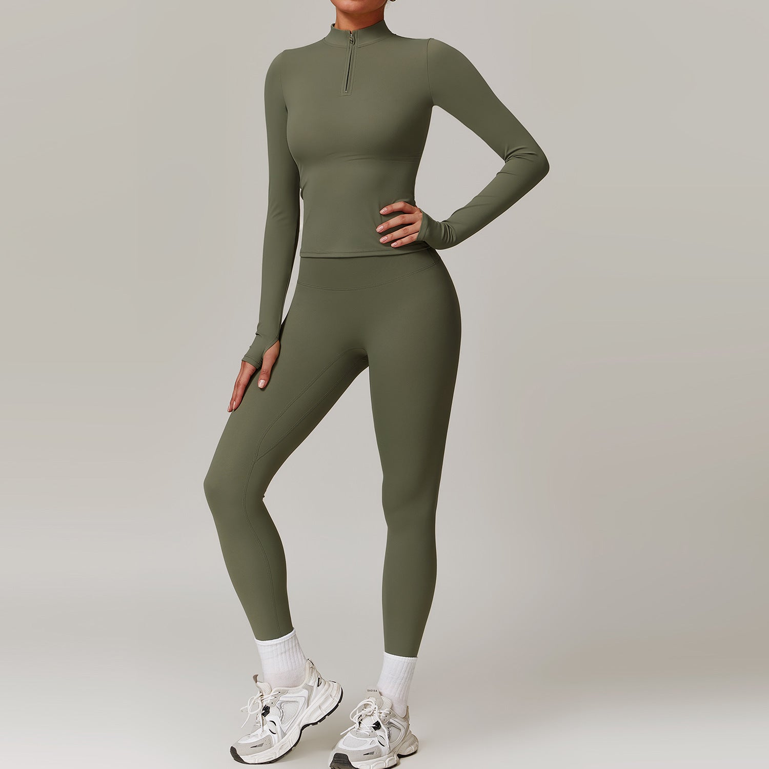 Olive green long-sleeved langry for outdoor running, paired with white sneakers