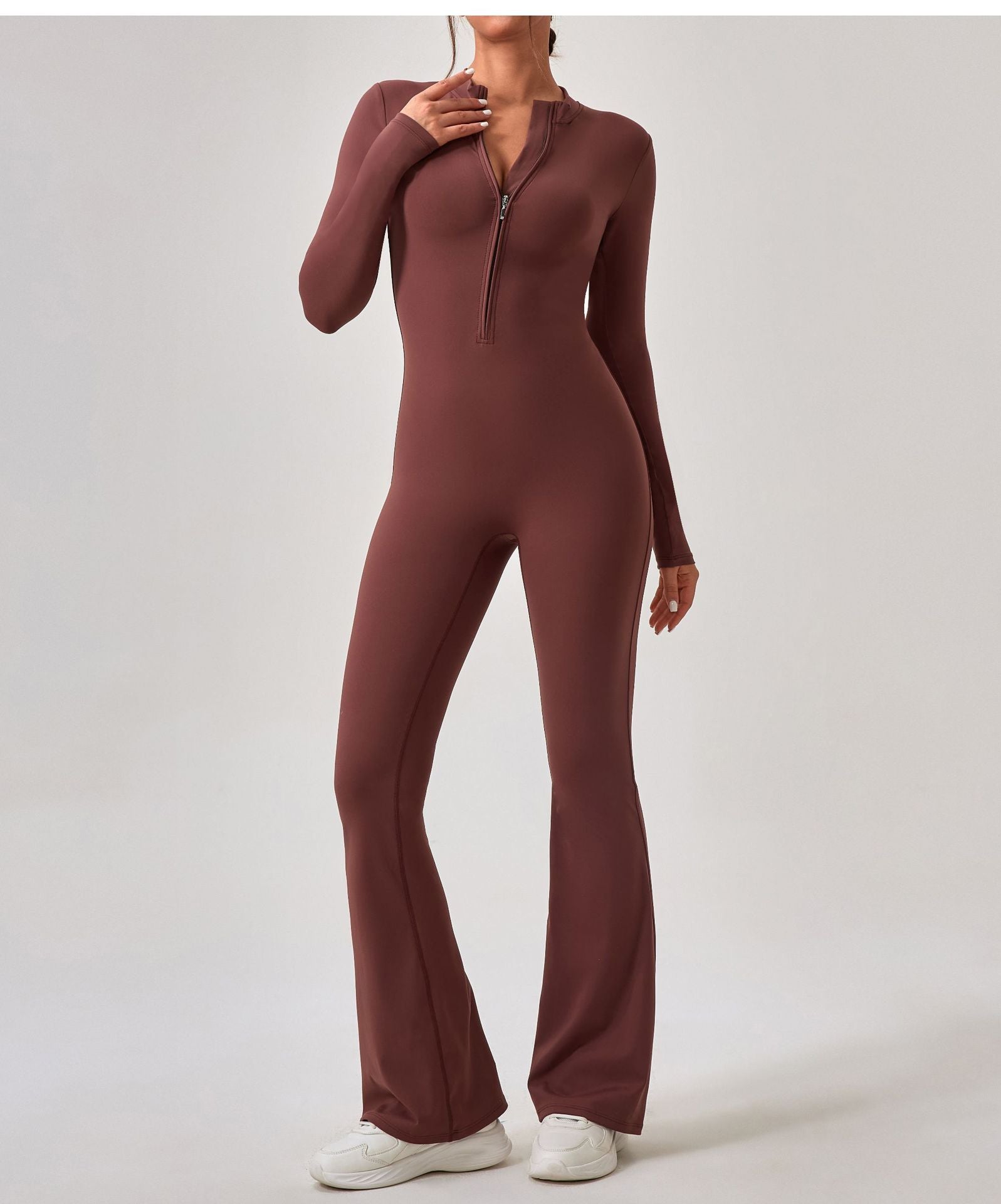 Brown long-sleeved zip-front jumpsuit with flared legs for fashionable sportswear ملابس