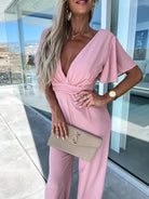 Pink V-neck jumpsuit with flutter sleeves, perfect for casual fashion and ملابس