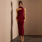 Burgundy velvet one-shoulder dress showcasing attractive hollowed sleeveless design in fashion