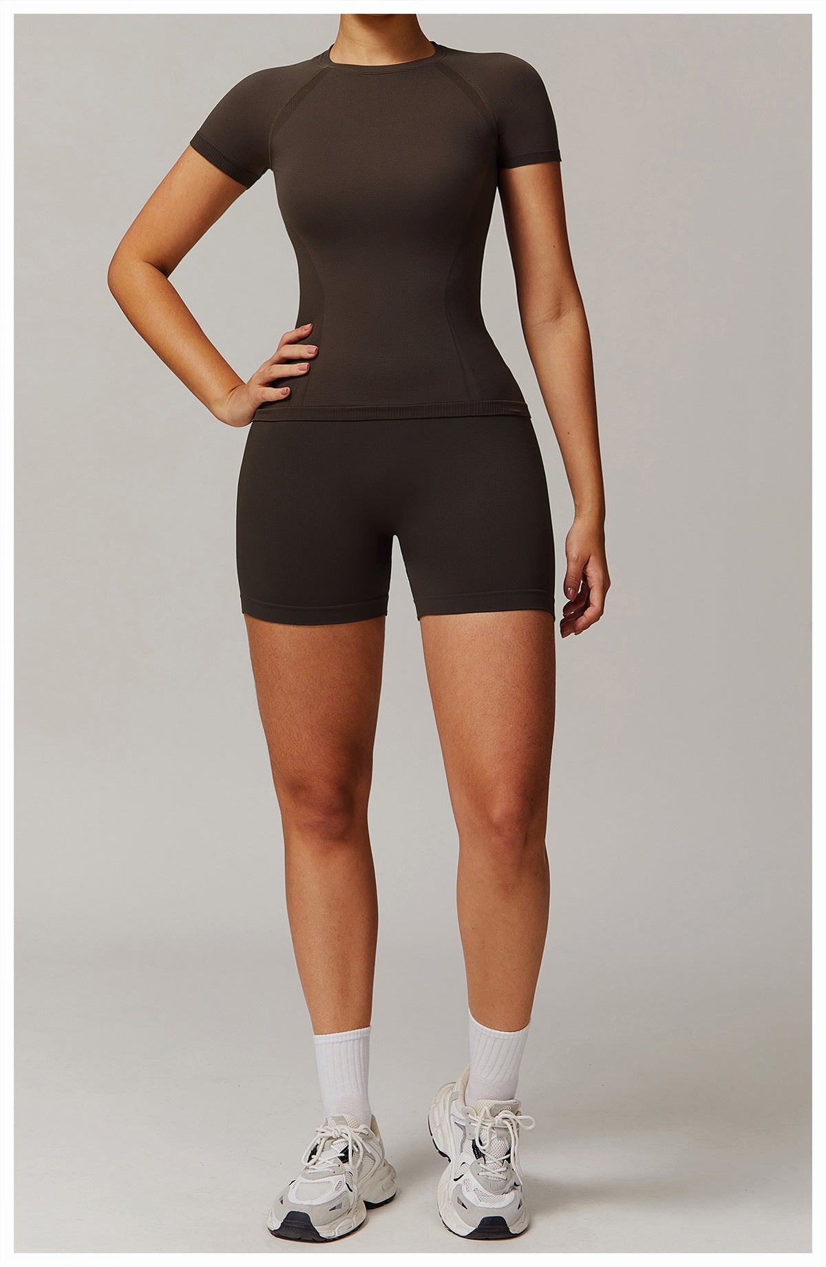 Dark athletic top and shorts set from Thread Seamless, perfect for yoga fashion ملابس