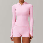 Pink long-sleeved hooded workout romper with shorts for stylish and comfy fashion ملابس