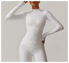 White fitted athletic jumpsuit with front zipper and long sleeves for casual running fashion