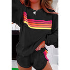 Black loungewear set featuring retro stripes in pink, orange, and yellow for stylish comfort