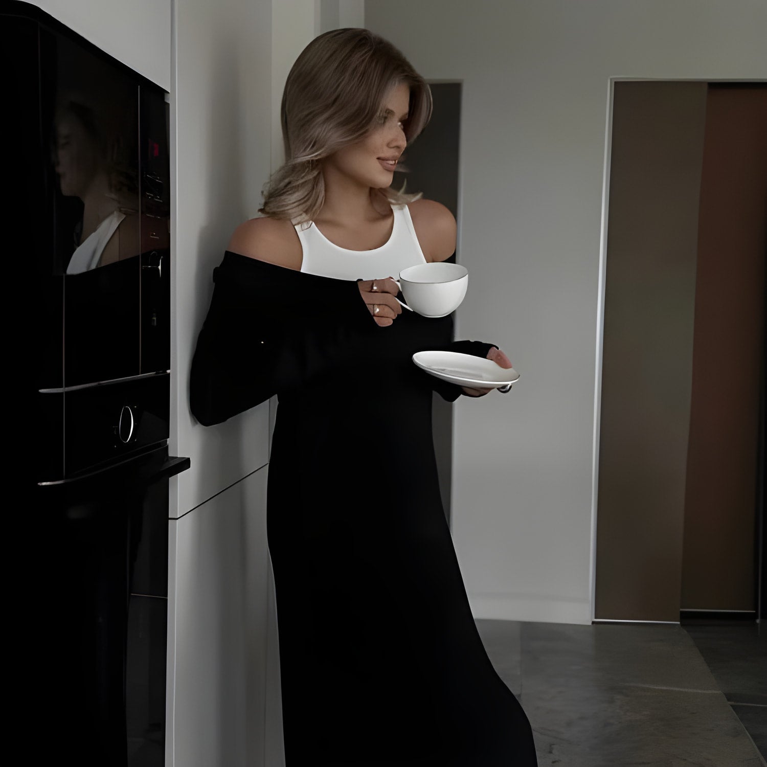 Person in a black and white cold-shoulder dress showcasing trendy langry fashion