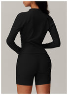 Black long-sleeved romper with fitted shorts for casual running fashion ملابس style