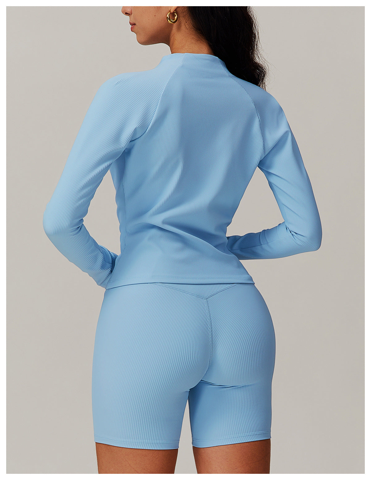 Light blue long-sleeved workout romper with shorts for casual running fashion ملابس