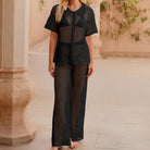 Black crochet lace loungewear set with short sleeves and wide-leg pants for casual fashion